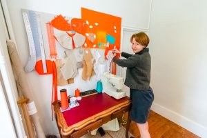 Maker in Residence, Sophia Lengle making wearable textile art in her studio at Studio Faire
